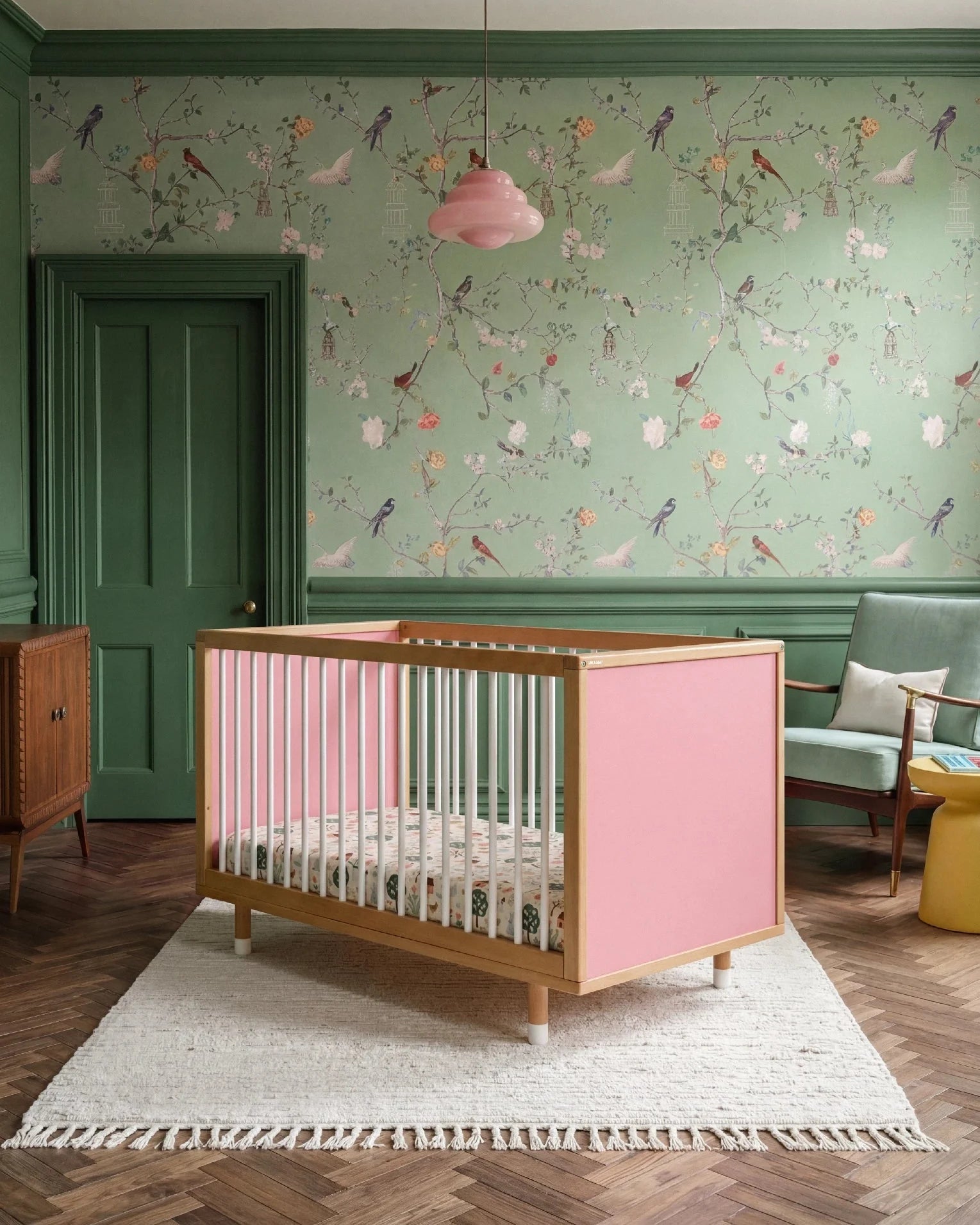 Bold Baby Cot in Pink and Green colourway, front view showing the pink panel