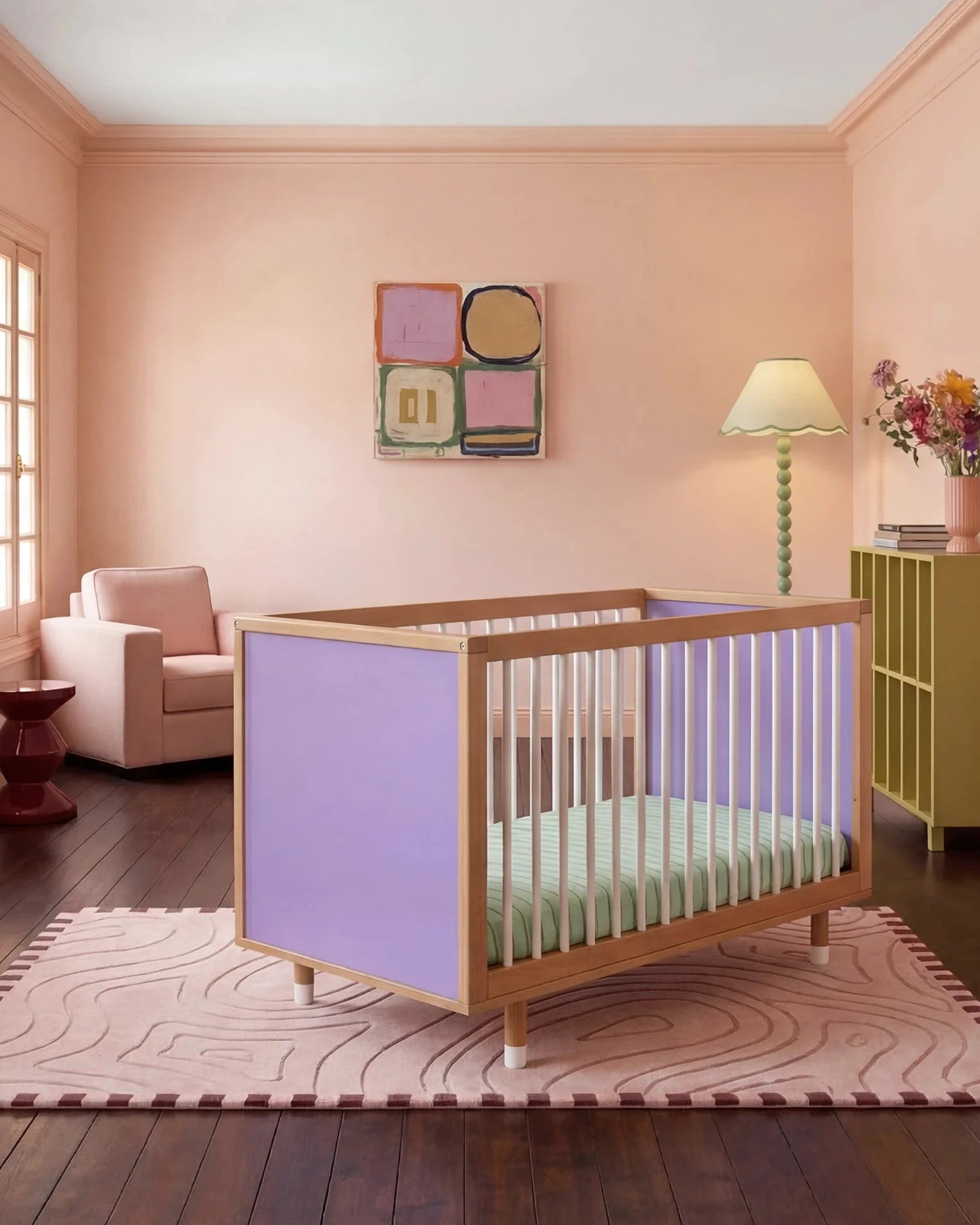 Bold Baby Cot in Lilac and Teal colourway, front three-quarter view showing the lilac panel