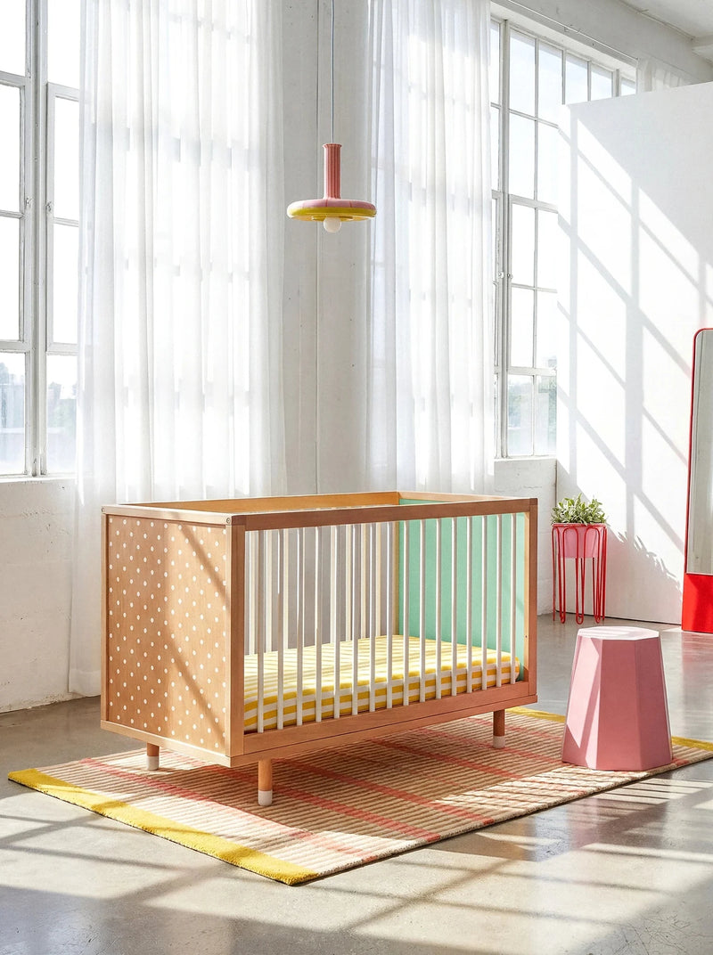 Polkadot and mint panels of the Bold Baby Cot