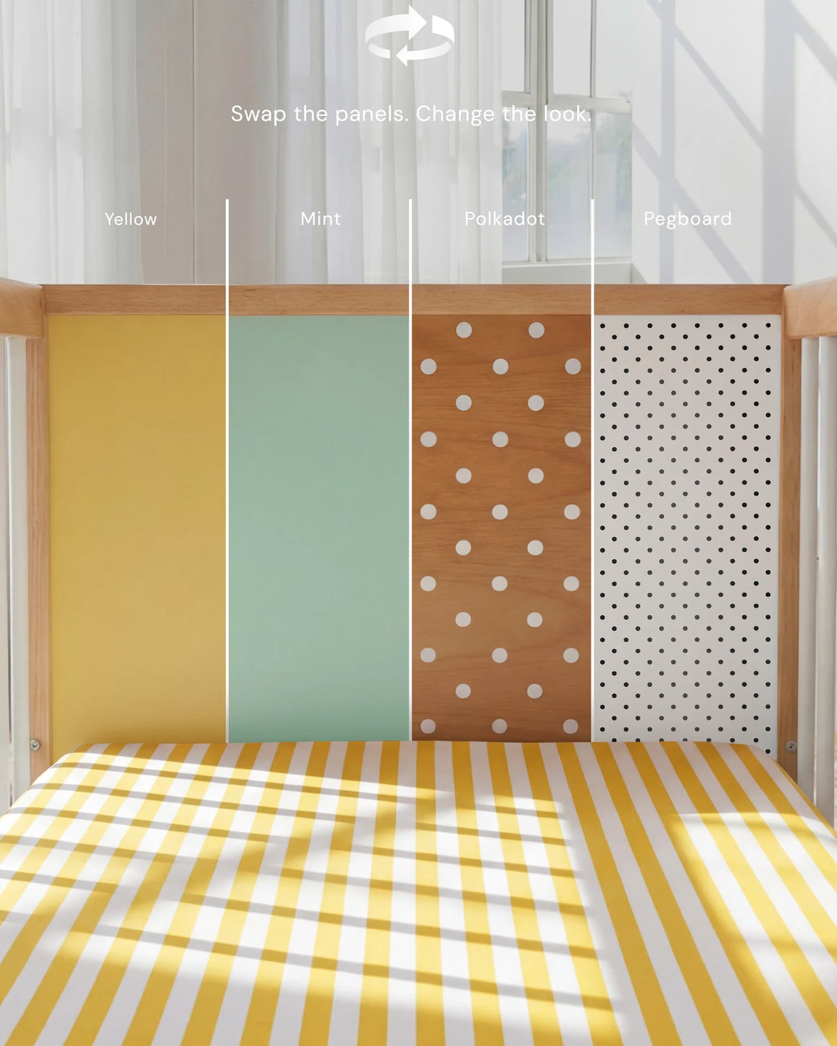 Demonstrating the interchangeable panel swap on the Yellow and Mint Bold Baby Cot