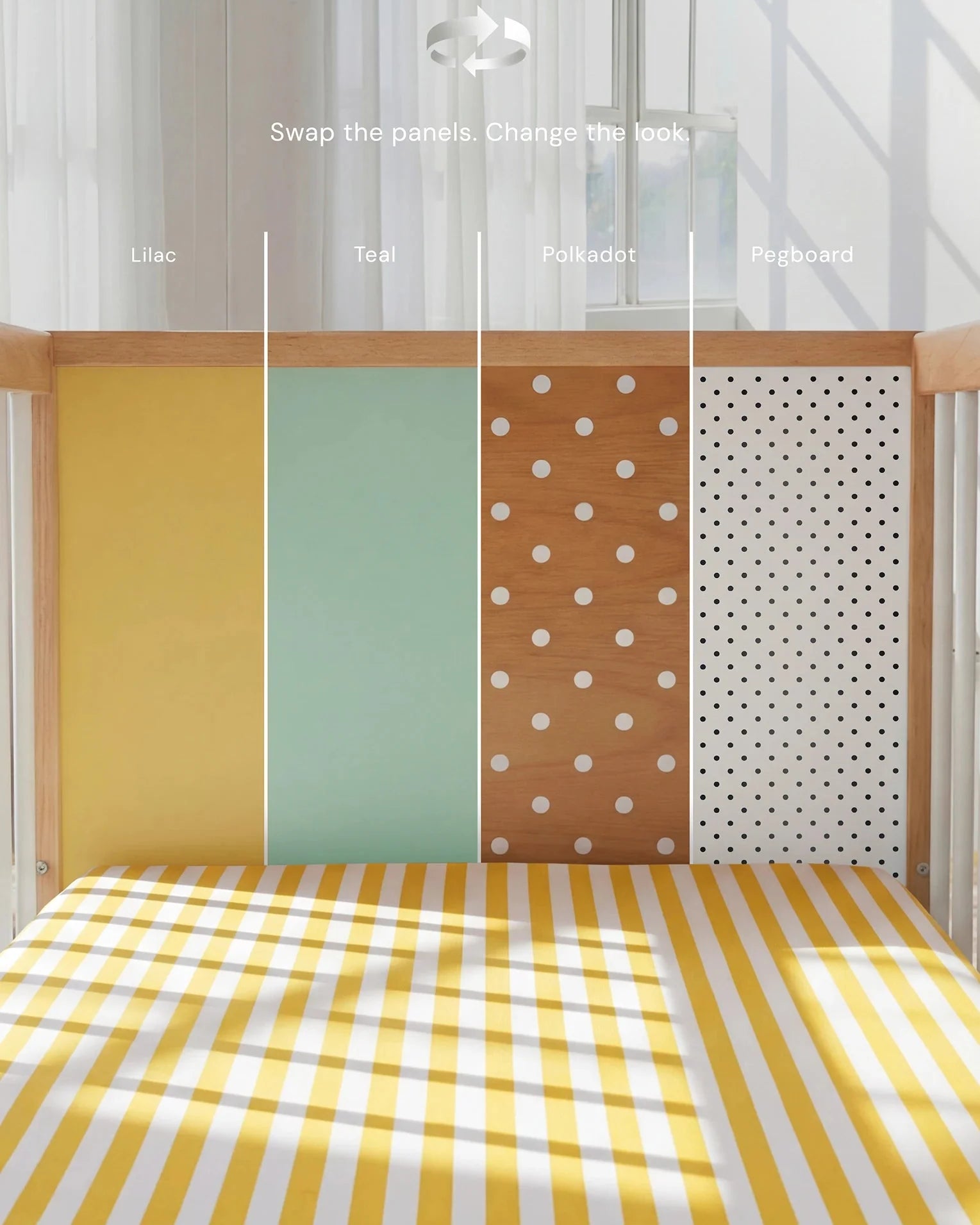 Demonstrating the interchangeable panel swap on the Yellow and Mint Bold Baby Cot