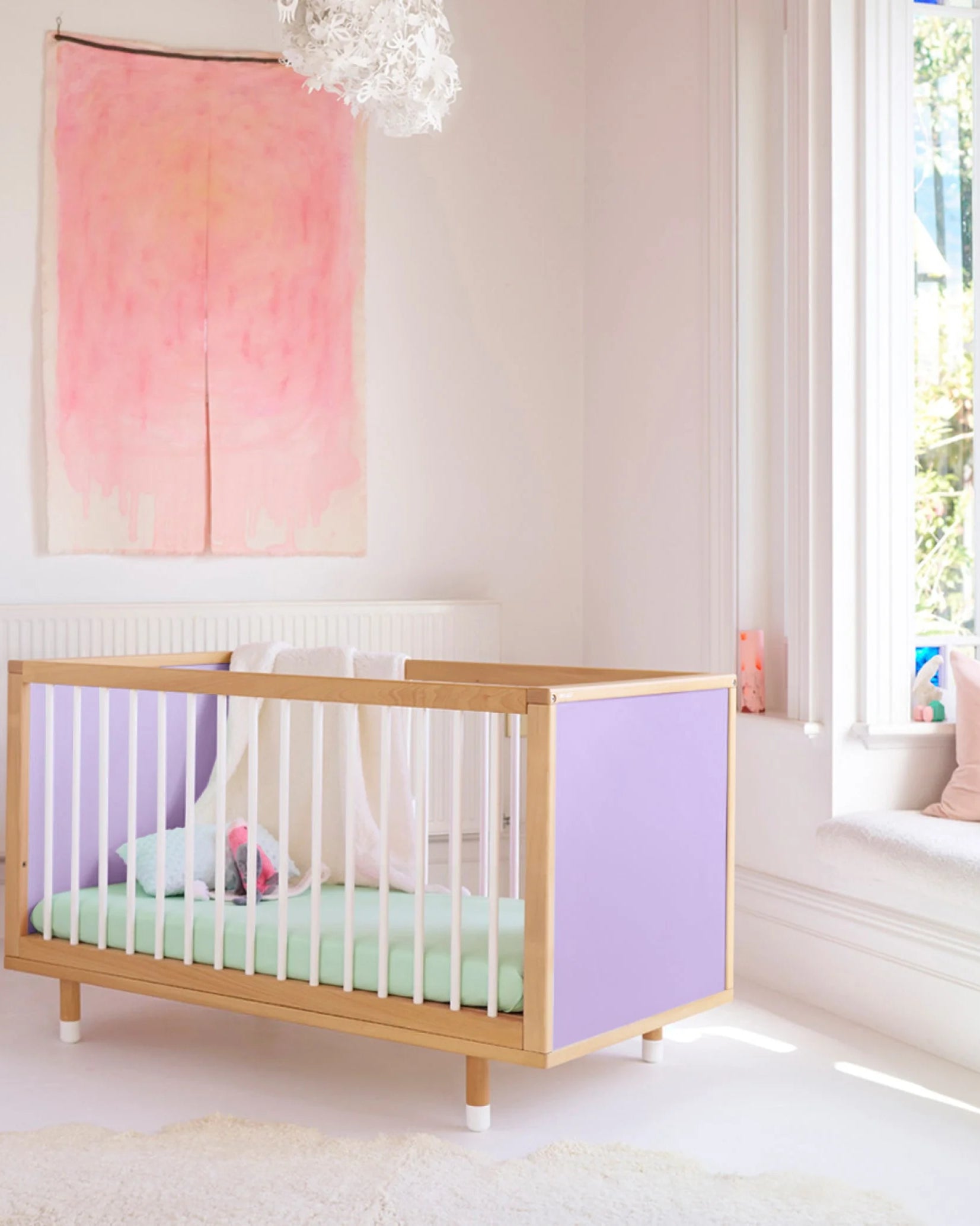 Lilac and Teal Bold Baby Cot styled in a nursery setting. Lilac panels on display.