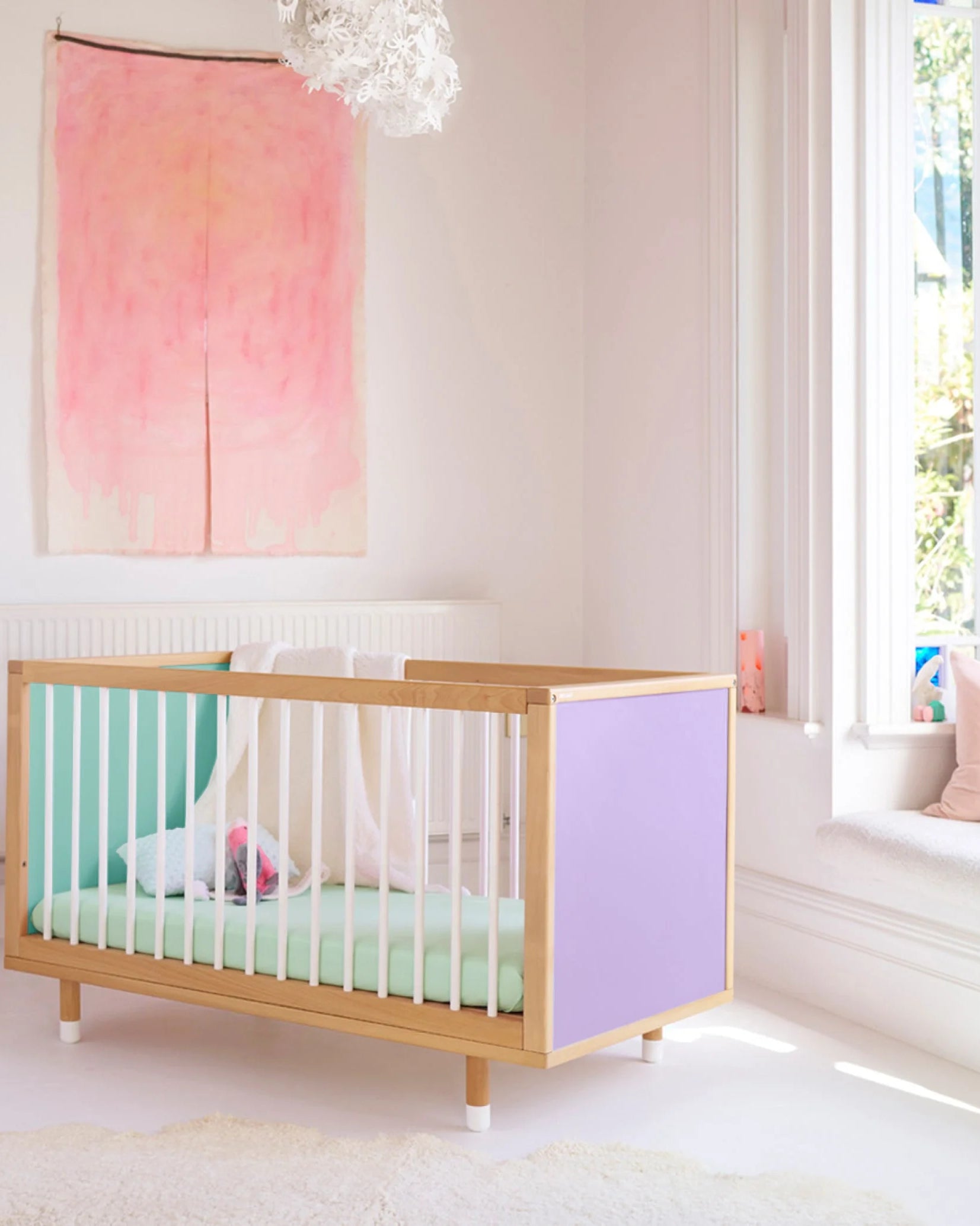 Lilac and Teal Bold Baby Cot shown in a styled nursery.