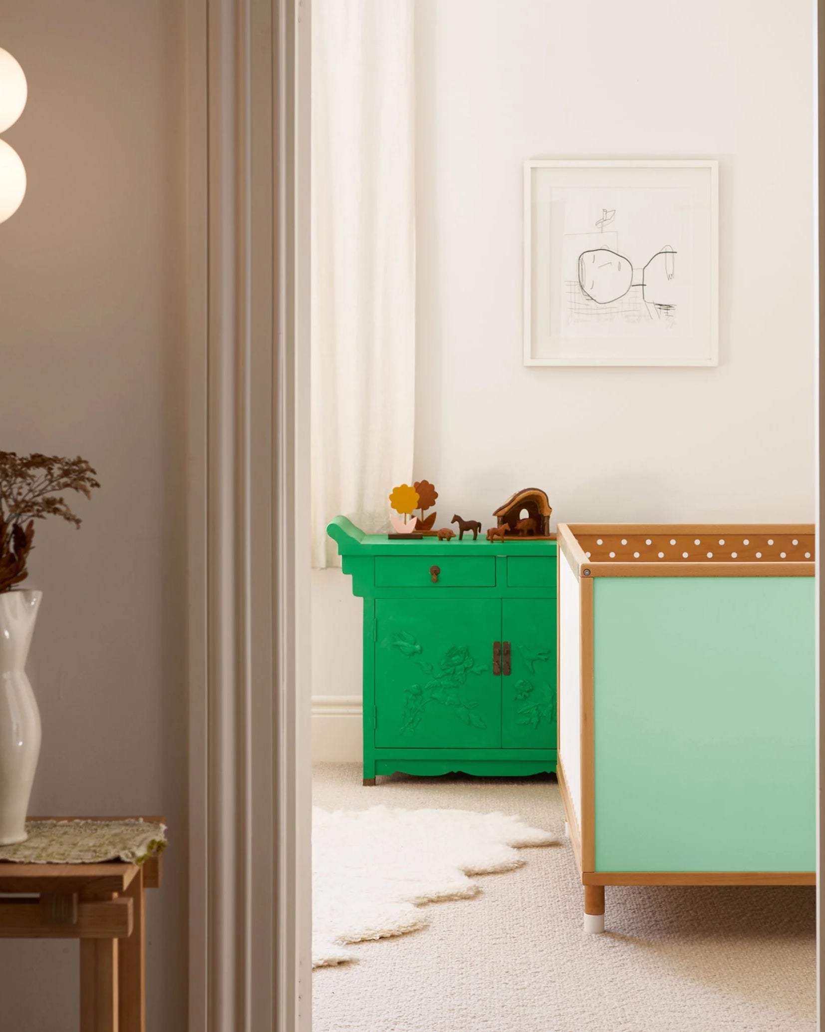Yellow and Mint Bold Baby Cot styled in a nursery setting