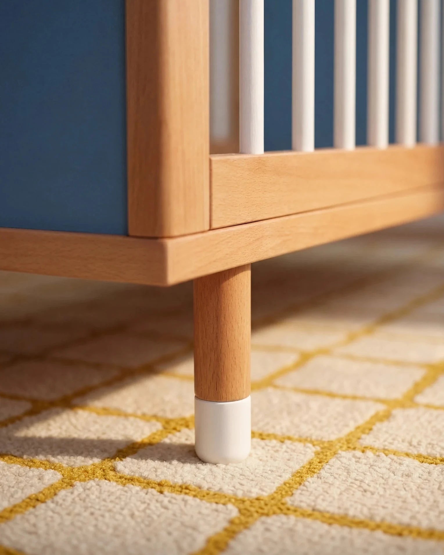 Detail of the adjustable leg on the Blue and Deep Blue Bold Baby Cot