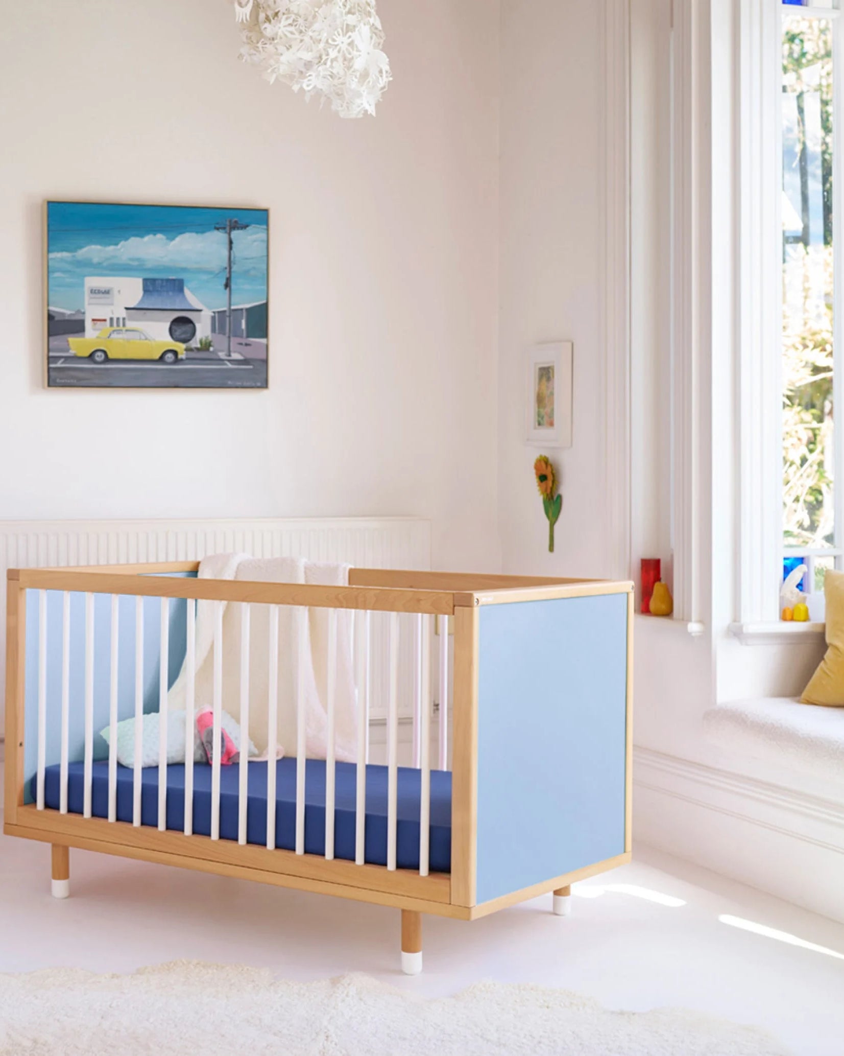 Blue and Deep Blue Bold Baby Cot styled in a nursery setting