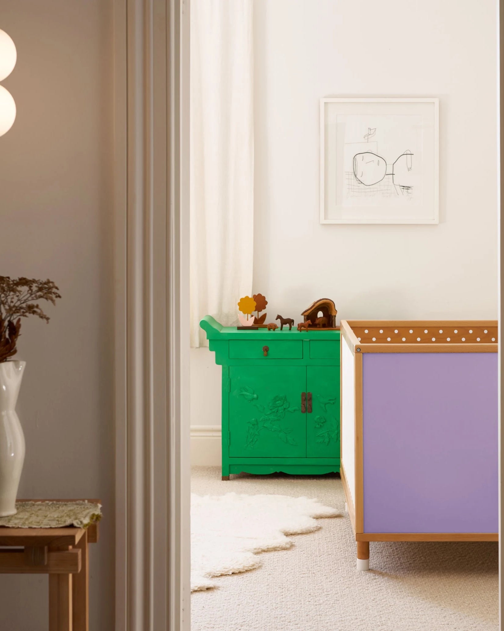 Lilac and polkadot panels of the Bold Baby Cot shown in a styled nursery.