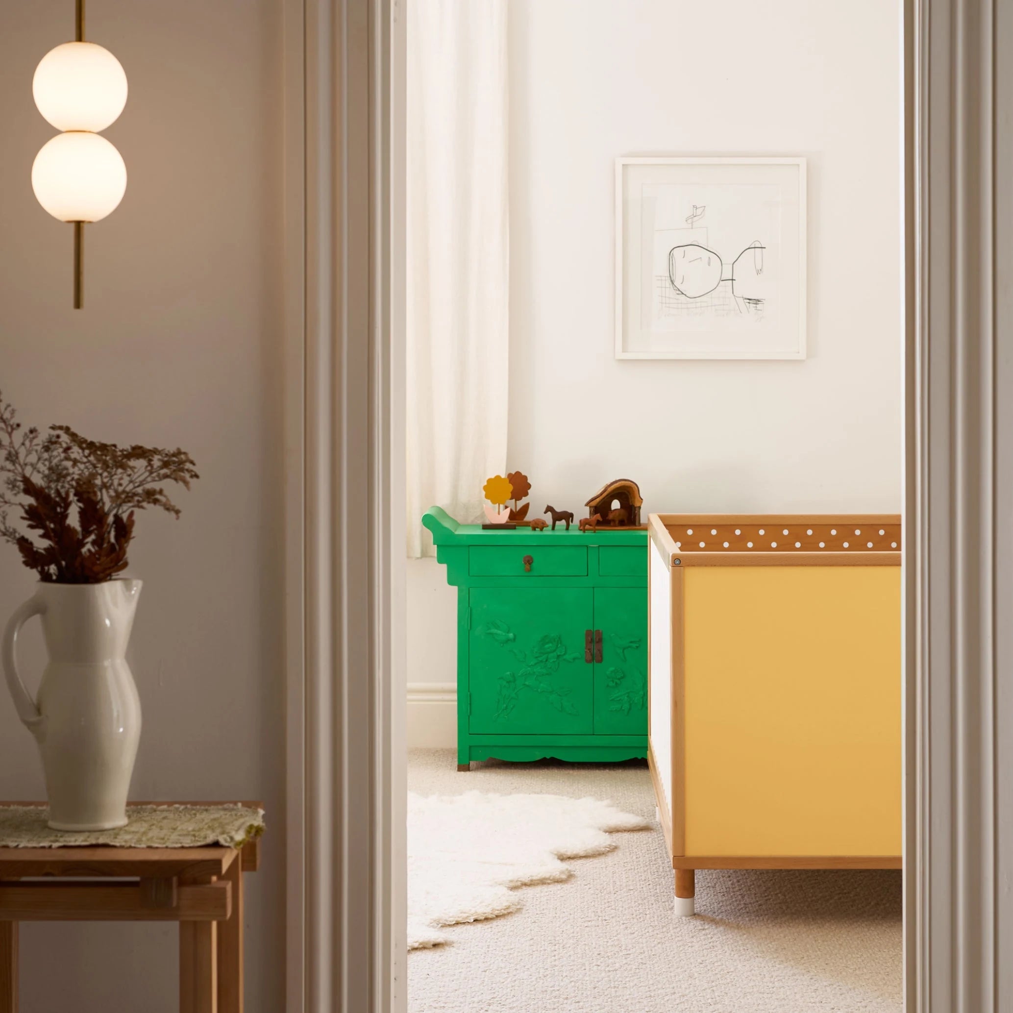 Yellow and Mint Bold Baby Cot, detail view of the timber frame and panels