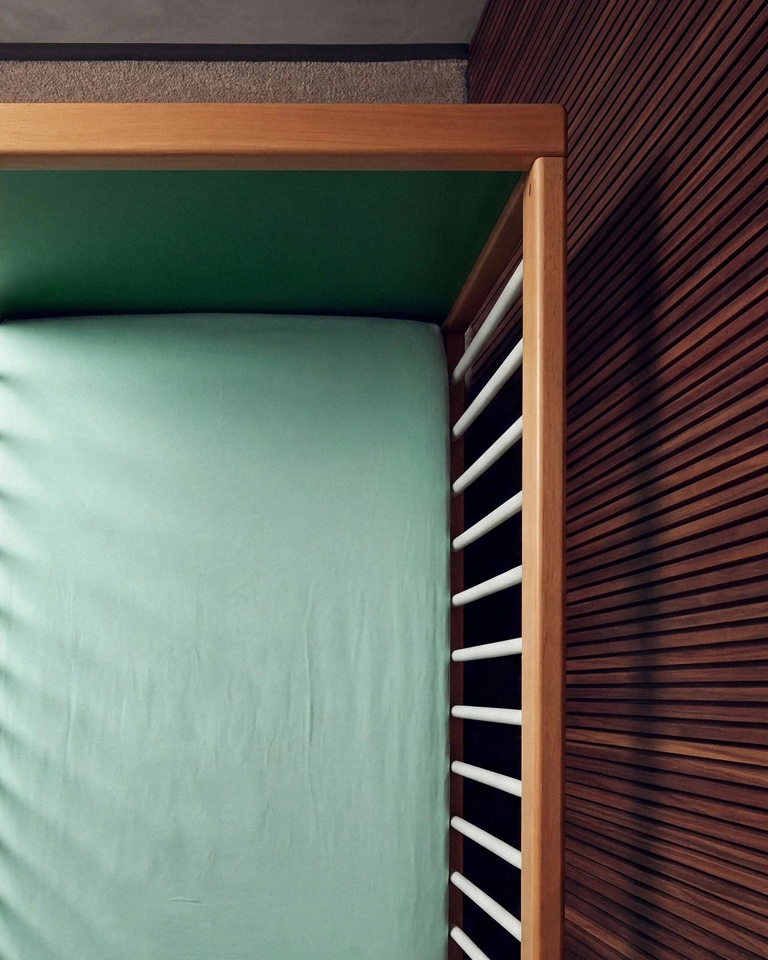 Overhead view of the Green and Mint Bold Baby Cot
