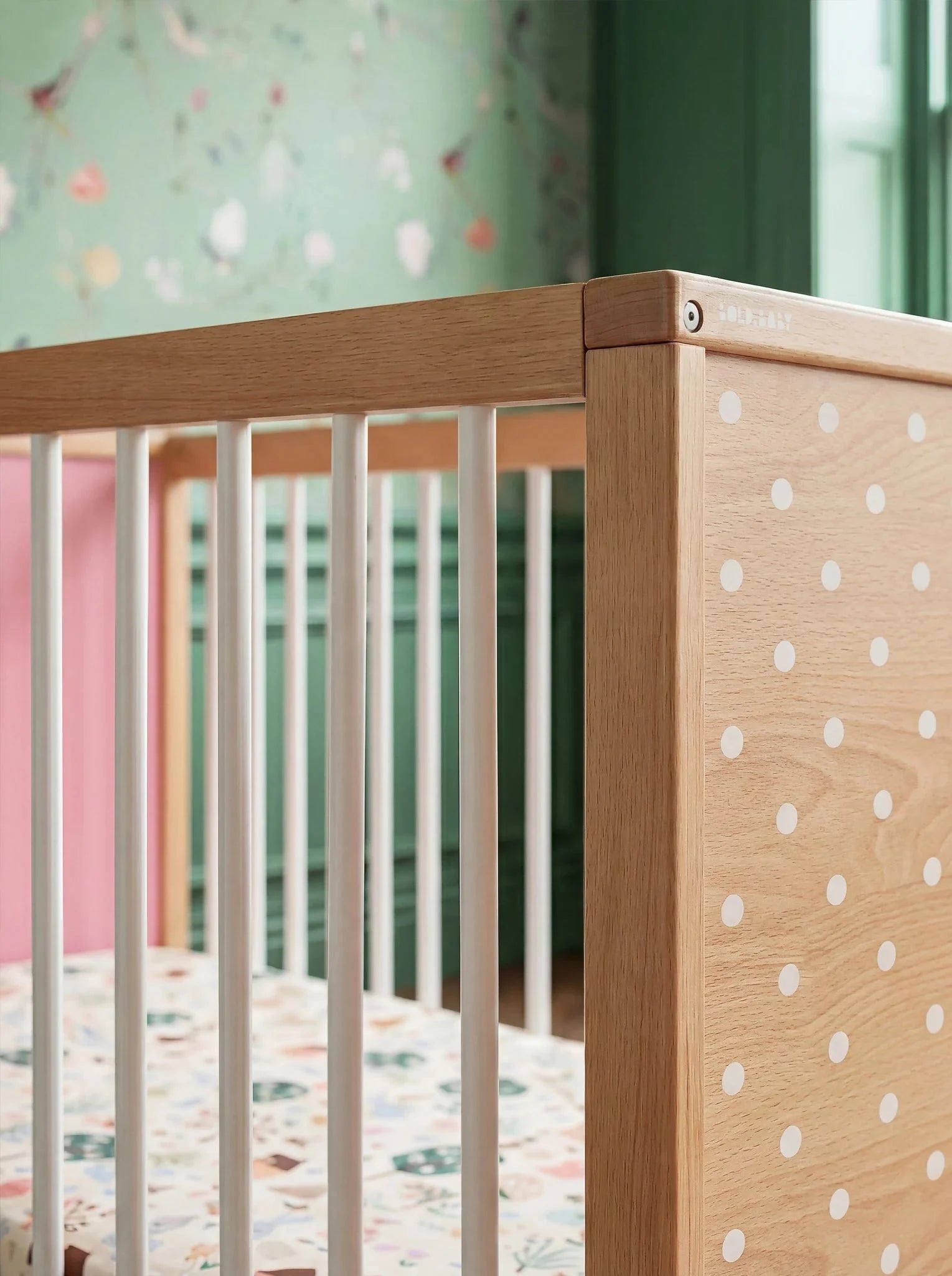 Close-up corner detail of the Pink and Green Bold Baby Cot panel