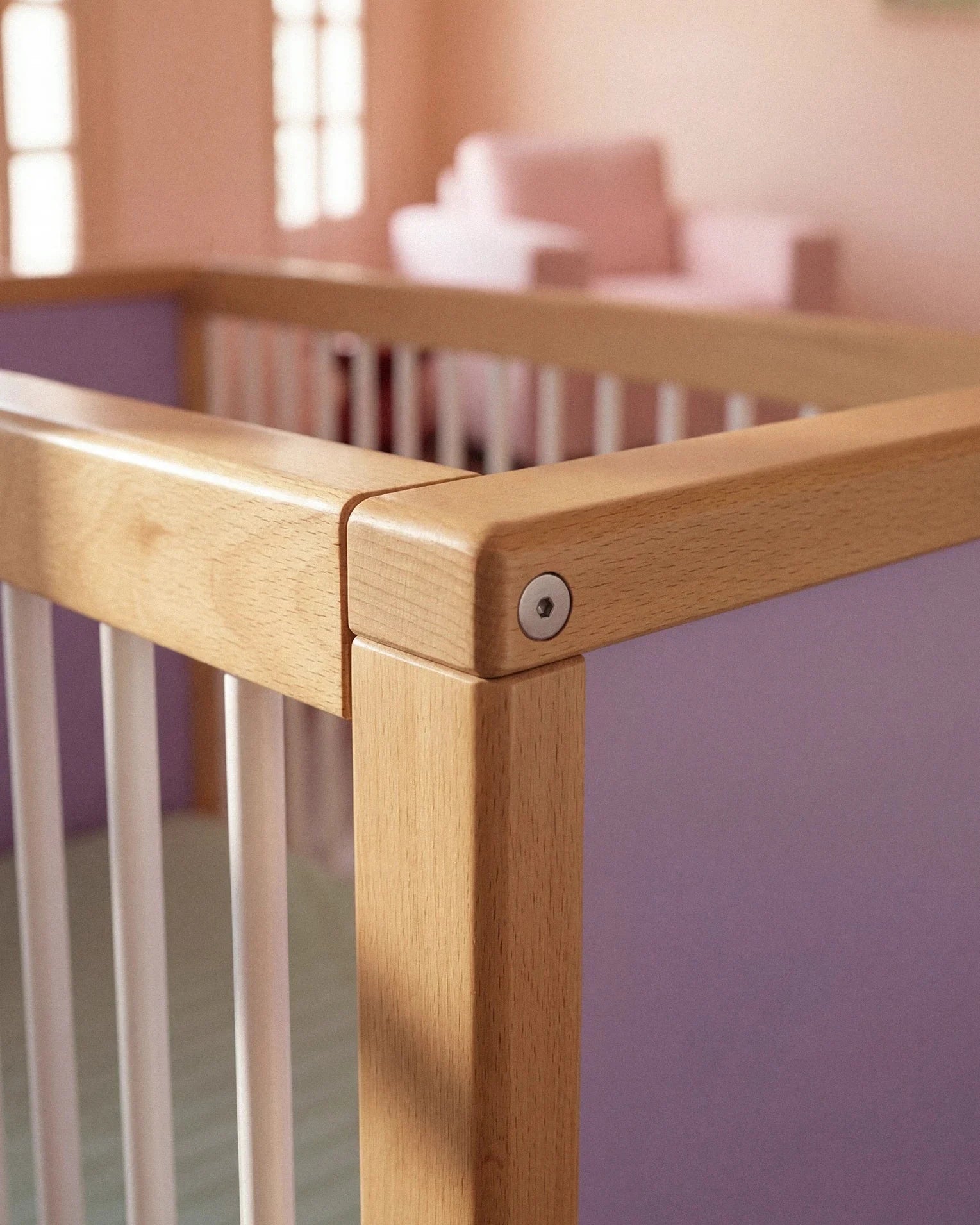 Close-up corner detail of the Lilac and Teal Bold Baby Cot panel