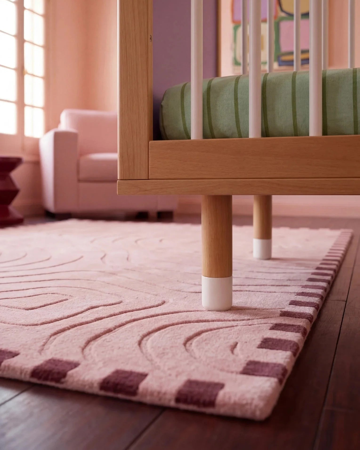 Detail of the adjustable legs on the Lilac and Teal Bold Baby Cot