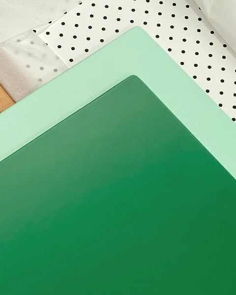Green mint and pegboard interchangeable panels of the Bold Baby Cot.