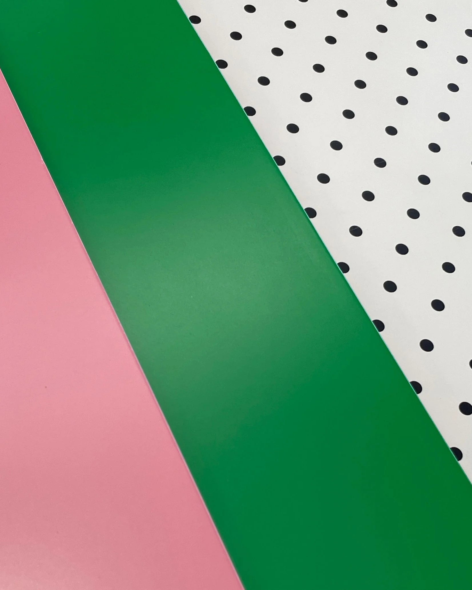 Pink, green and pegboard Bold Baby Cot panels.