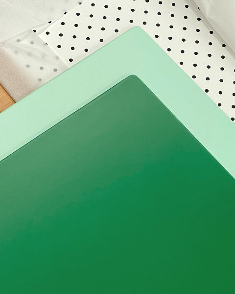 Green and mint boards with polkadots