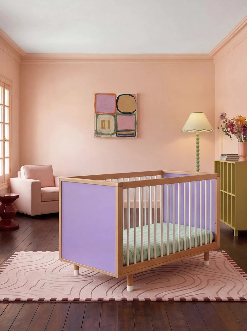 Bold Baby Cot in Lilac and Teal colourway, front three-quarter view showing the lilac panel