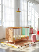 Polkadot and mint panels of the Bold Baby Cot