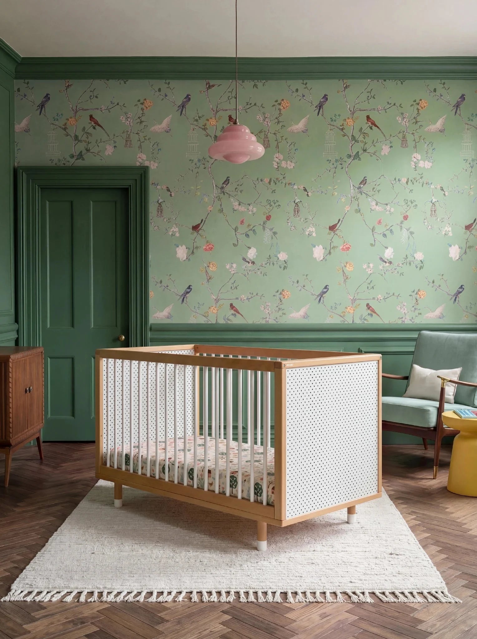 Bold Baby Cot in Pink and Green colourway, front view showing the pegboard panel