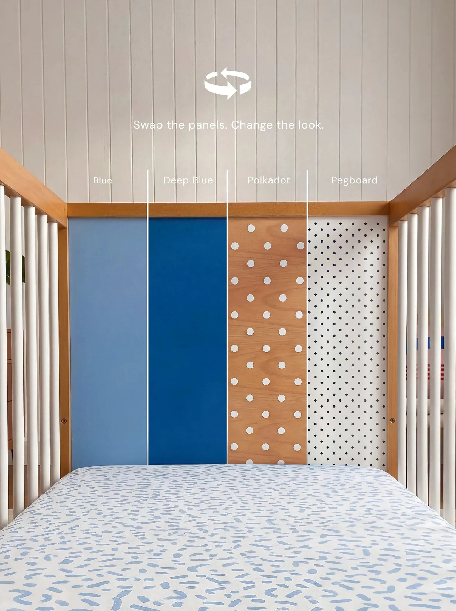 Demonstrating the interchangeable panel swap on the Blue and Deep Blue Bold Baby Cot
