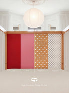 Demonstrating the interchangeable panel swap on the Pink and Red Bold Baby Cot