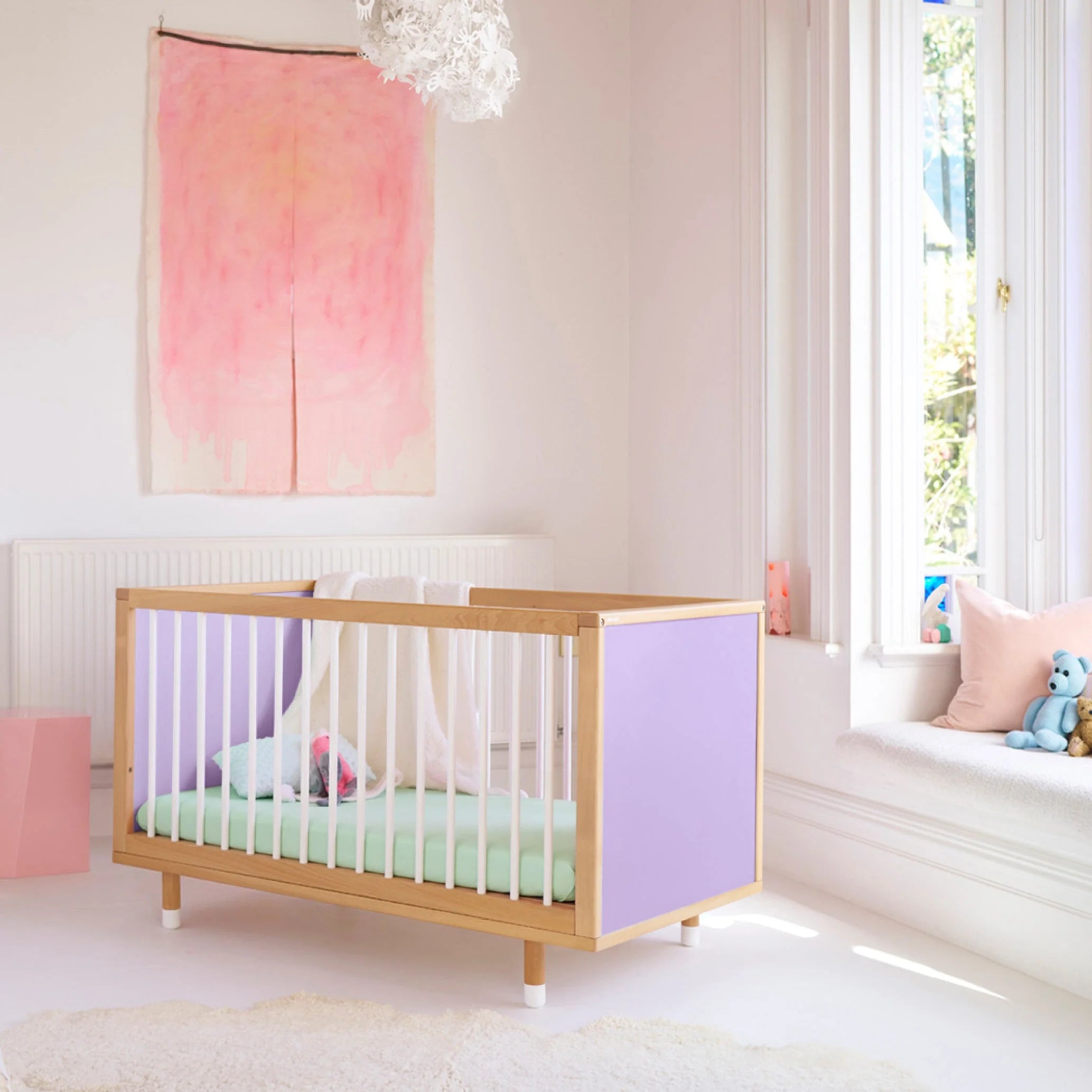 Lilac and Teal Bold Baby Cot styled in a nursery setting. Lilac panels on display.
