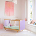 Lilac and Teal Bold Baby Cot styled in a nursery setting. Lilac panels on display.