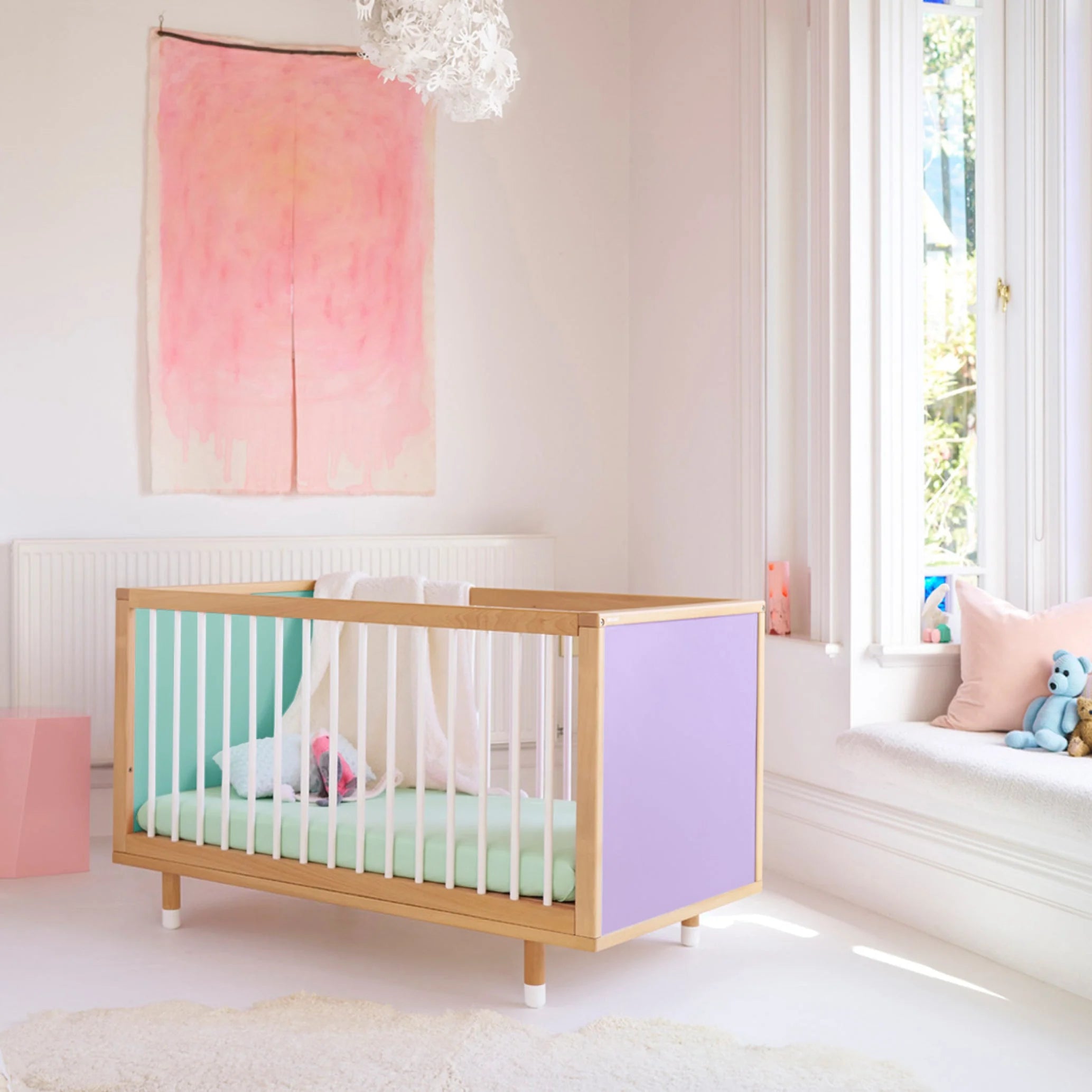 Lilac and Teal Bold Baby Cot shown in a styled nursery.