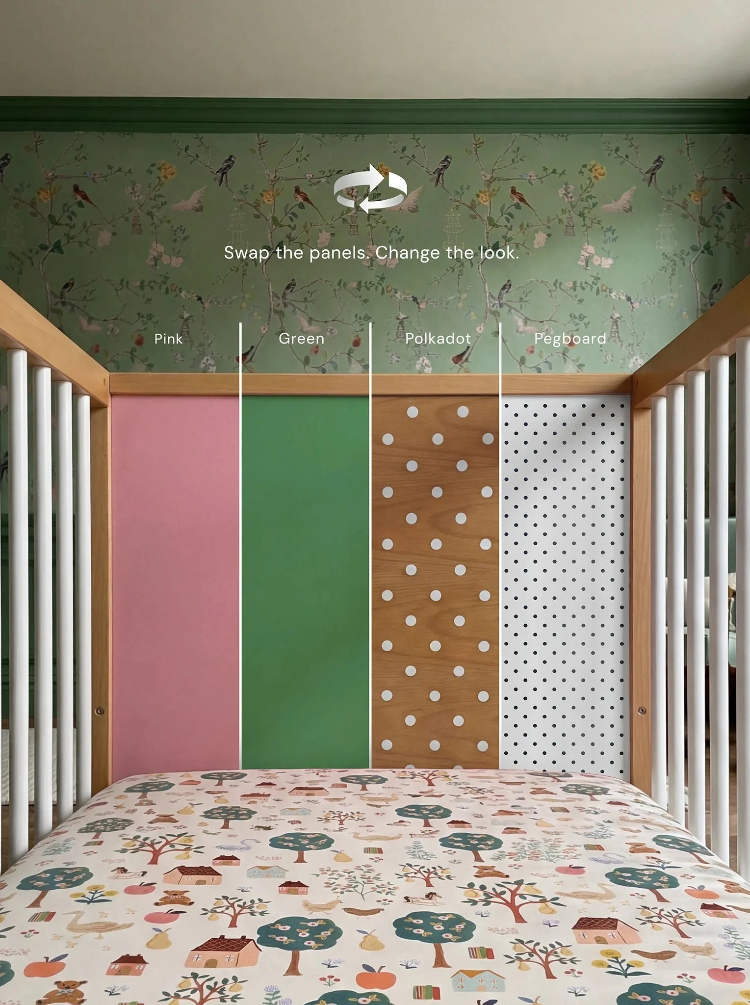 Demonstrating the interchangeable panel swap on the Pink and Green Bold Baby Cot