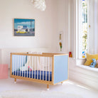 Blue and Deep Blue Bold Baby Cot styled in a nursery setting