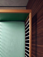 Overhead view of the Green and Mint Bold Baby Cot