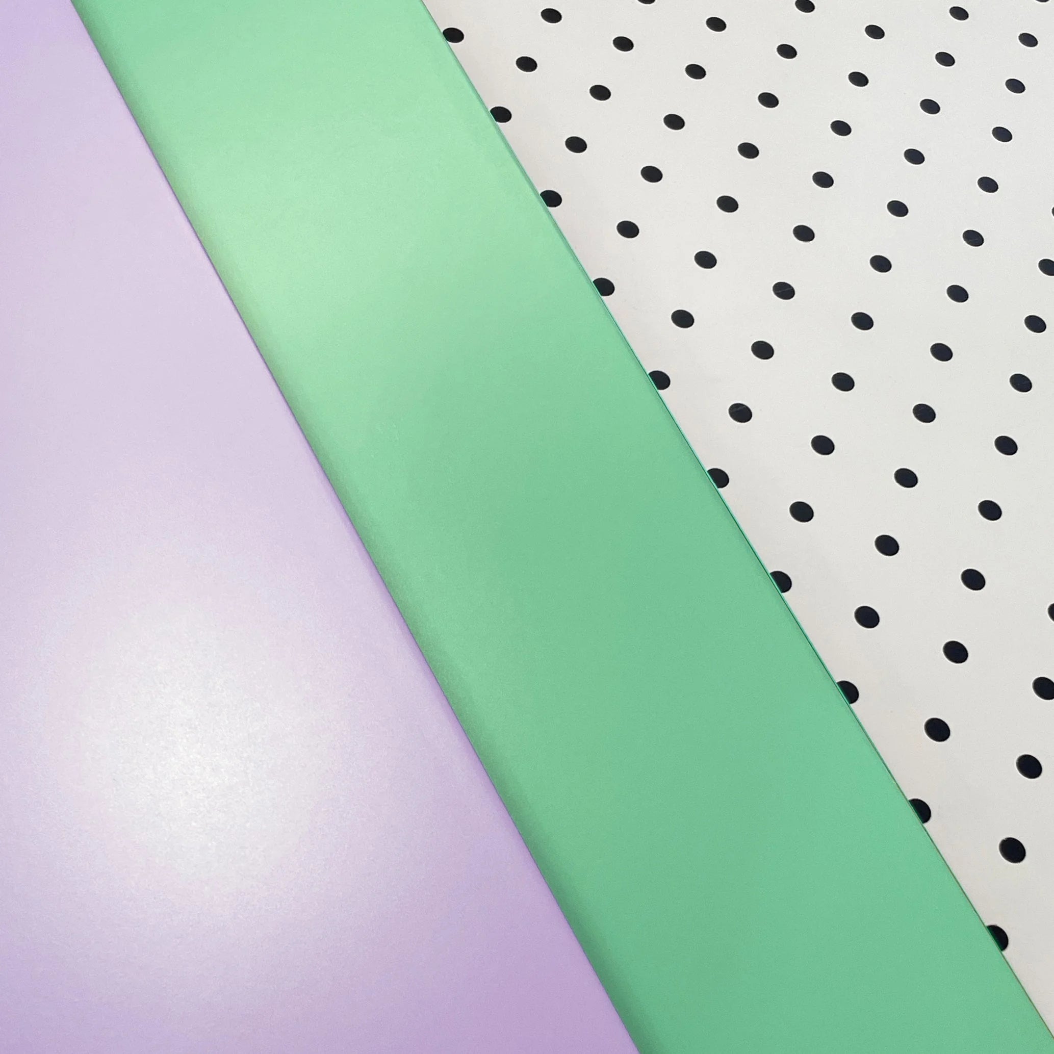 Lilac, Teal and pegboard panels of the Bold Baby Cot