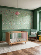 Side view of the Pink and Green Bold Baby Cot showing the polkadot and pink panels.
