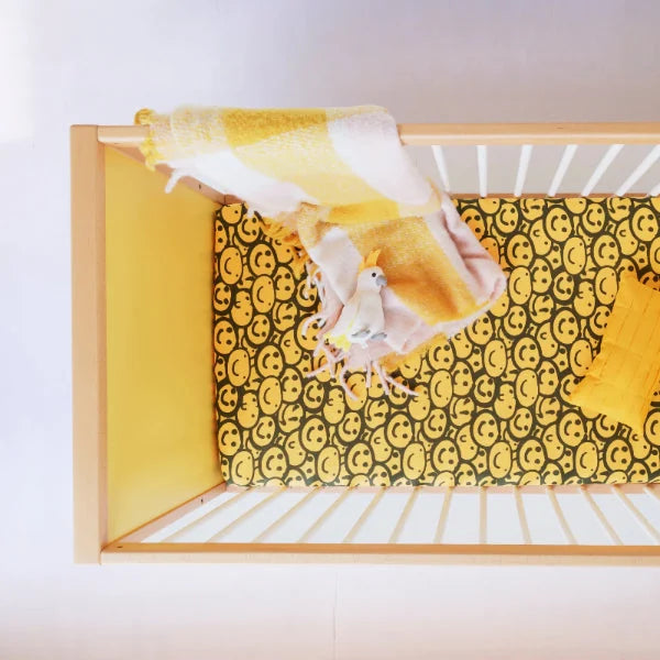 Overhead view of a yellow panel of the Bold Baby Cot