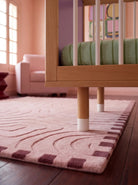 Detail of the adjustable legs on the Lilac and Teal Bold Baby Cot