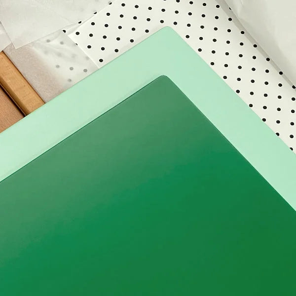 Green mint and pegboard interchangeable panels of the Bold Baby Cot.