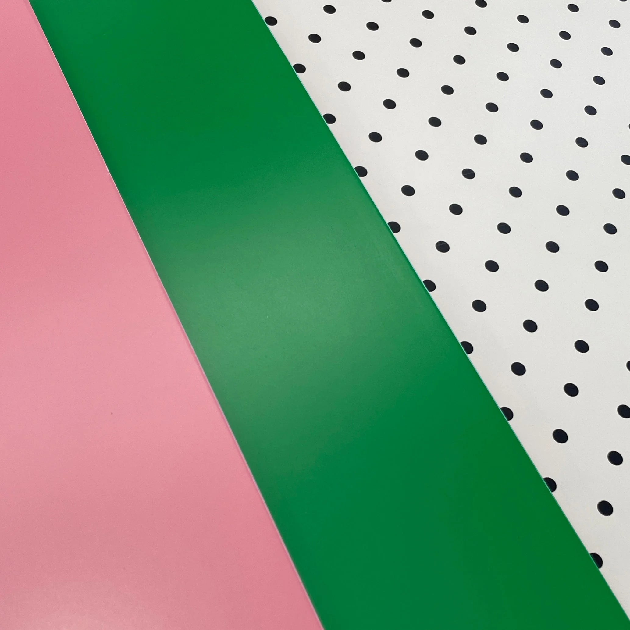 Pink, green and pegboard Bold Baby Cot panels.