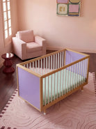 Top-down three-quarter view of the Lilac and Teal Bold Baby Cot