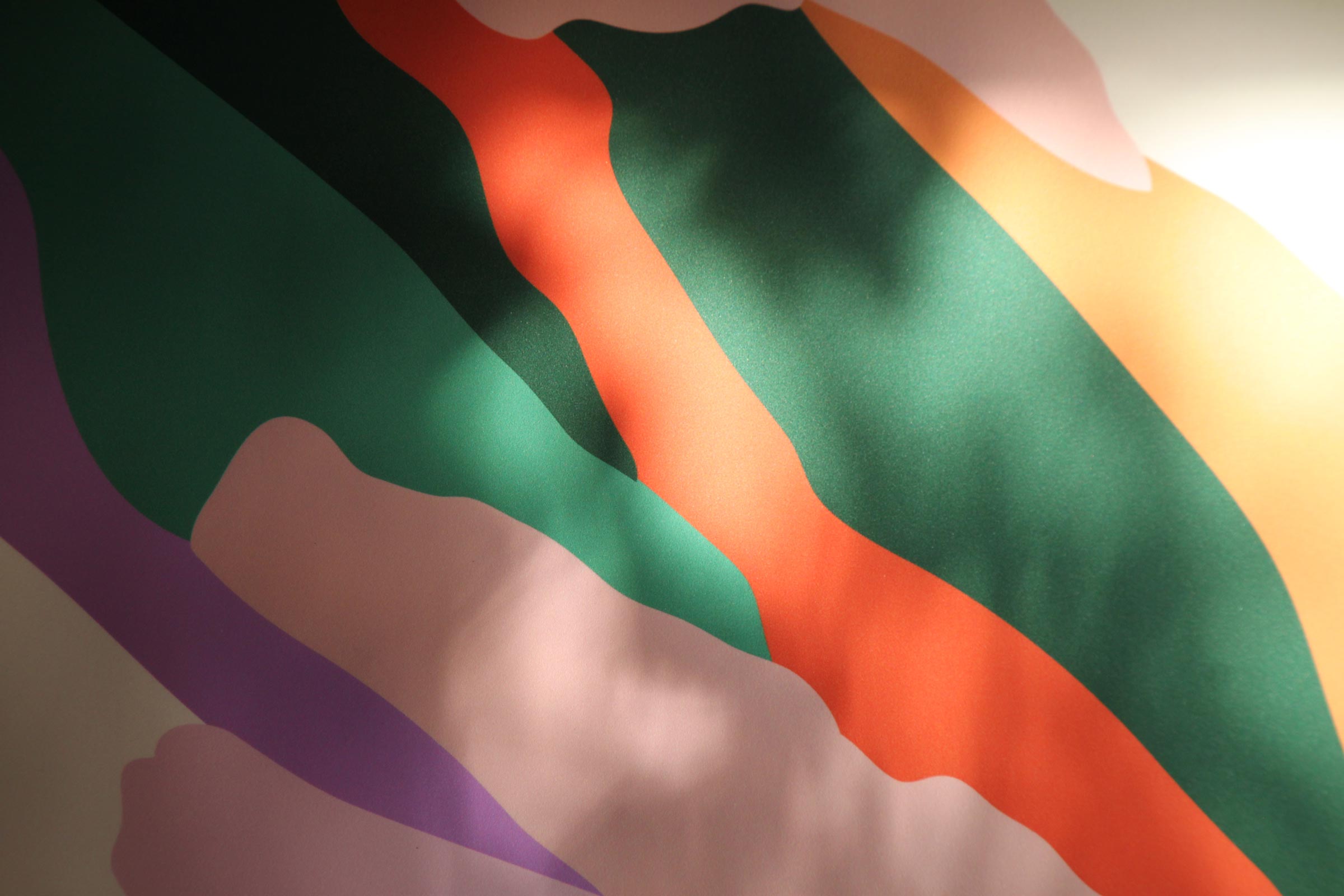 Close-up of a colorful abstract painting with wavy lines.