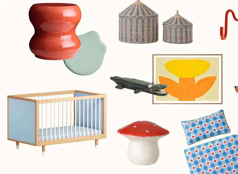 A blue baby cot in a collection of nursery items.