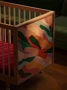 Bold Baby Art Series cot with Janelle Burger's colourful illustrated end panels