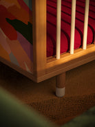 Adjustable leg and panel detail of the Bold Baby Art Series cot